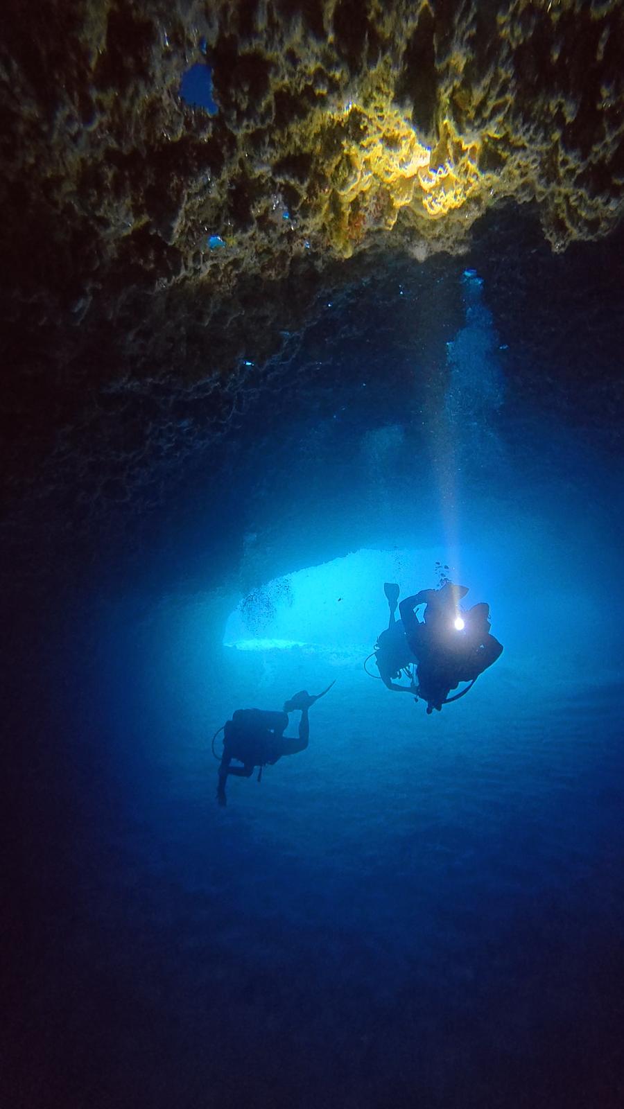 Divers inside the Blue Cathedral cavern